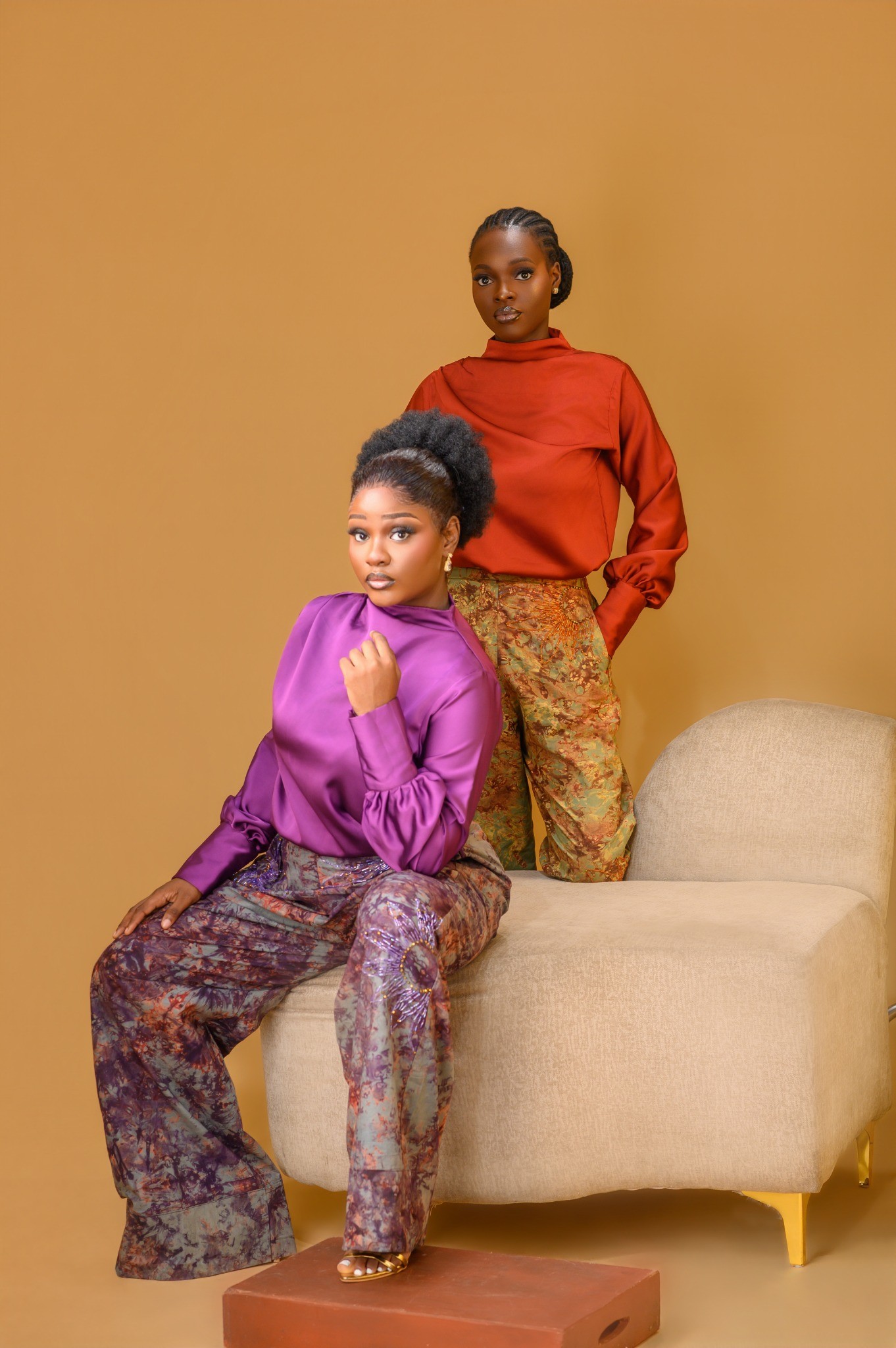 Ladies wearing the Estelle set in Maroon and Orange colour