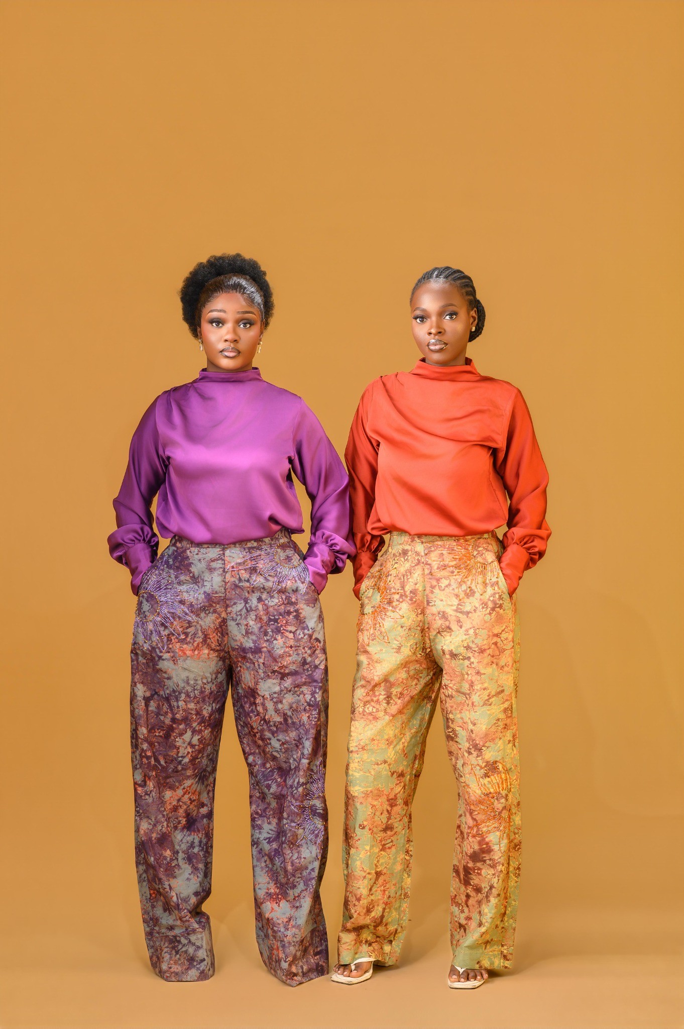 Two ladies wearing the Estelle set in Maroon and Orange colour
