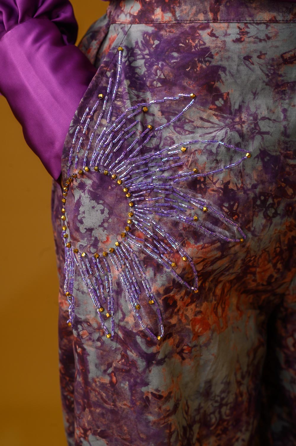 A zoomed in image of a lady wearing the Estelle set in Maroon colour