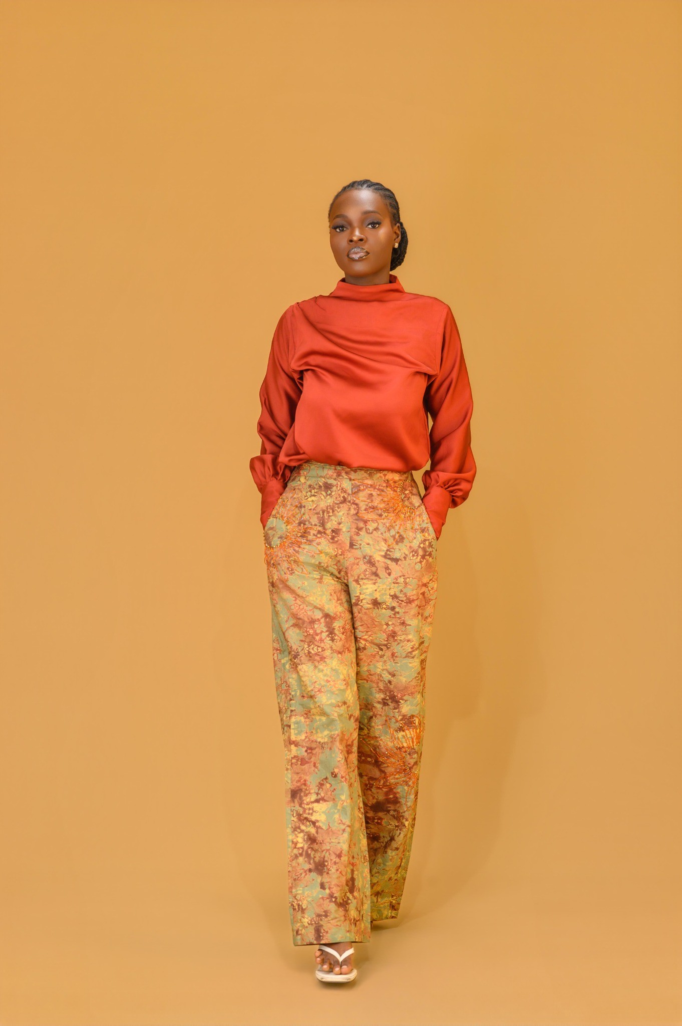 A lady wearing the Estelle set in Orange colour