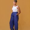 A lady wearing the Quinn barell pant and a white tank top
