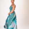 A lady wearing the Zuri dress in green colour